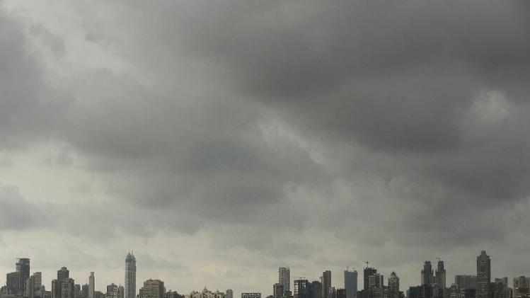 Dark clouds gather over city skyline in Mumbai on July 2, 2012