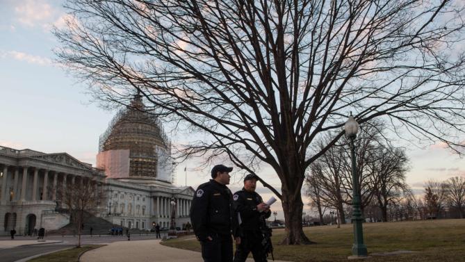 Police patrol on Capitol Hill in Washington, DC, before US President Barack Obama delivers the State of the Union address