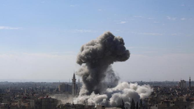 A cloud of smoke rises following an air strike by Syrian government forces in the rebel-held area of Douma, north east of the capital Damascus, on February 5, 2015