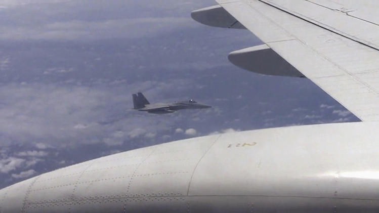 Still image from video footage of Japanese F-15 jet and Chinese Tu-154 jet over the East China Sea