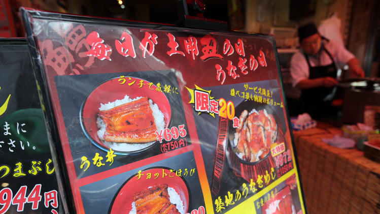 A menu of eel dish is displayed at an eel specialized restaurant in Tokyo, Friday, June 13, 2014. The Japanese eel, a popular summertime delicacy, has been put on the international conservation “red list,” adding to worries over the decline of the increasingly endangered species. Japan’s agriculture minister urged that efforts to boost the eel population be stepped up after the International Union for Conservation of Nature this week designated the Japanese eel as “endangered,” or facing a very high risk of extinction. (AP Photo/Eugene Hoshiko)
