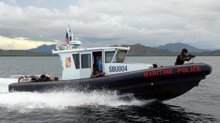 Members of Philippine Maritime police Special Boat Unit, riding on US-made gun boats, maneouver during a training exercise in Honda Bay, off Puerto Princesa, Palawan island, southwest of Manila, on June 6, 2014