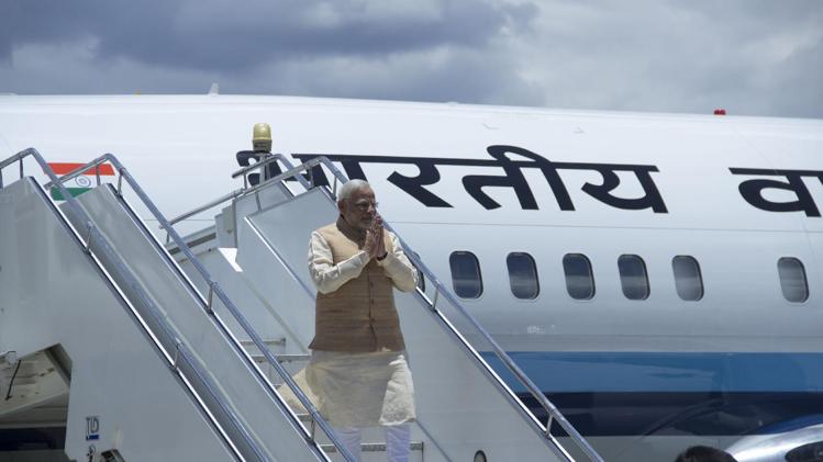 Indian Prime Minister Narendra Modi pictured on the steps of a plane about to leave Paro, Bhutan on June 15, 2014
